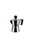 Shiny stainless steel moka pot by Alessi with black handle, knob, and a distinctive man silhouette on the side.