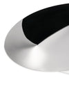 Silver metallic basket by Alessi, with a polished finish and a contrasting dark black interior, in a modern, curved design.