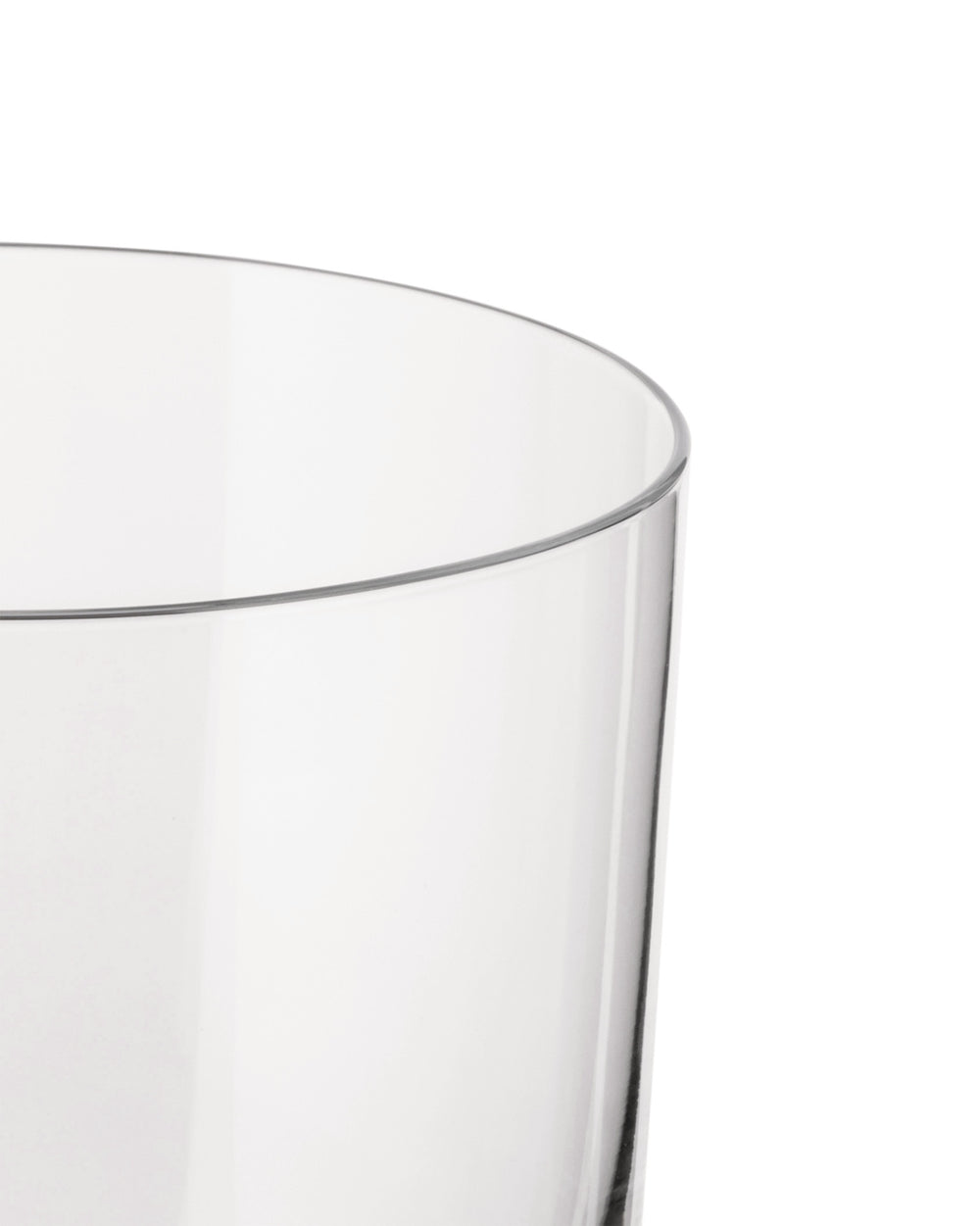 Clear glass by Alessi with a rounded rim, cropped side view.