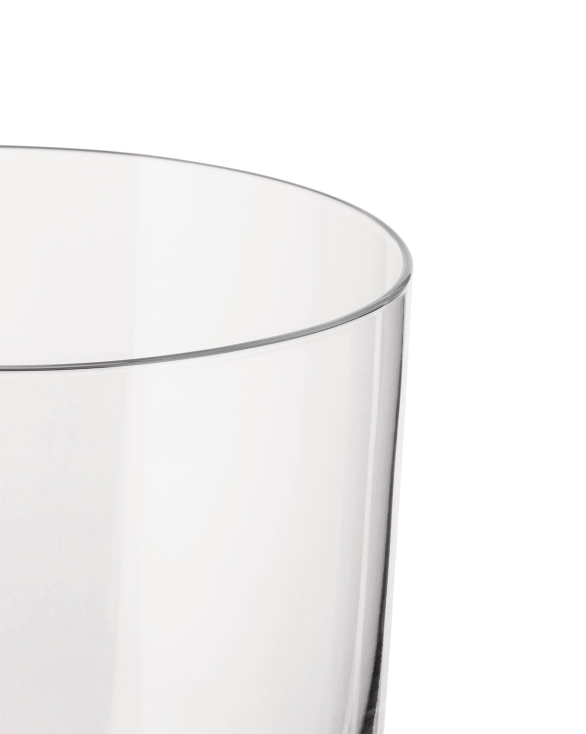 Clear glass by Alessi with a rounded rim, cropped side view.