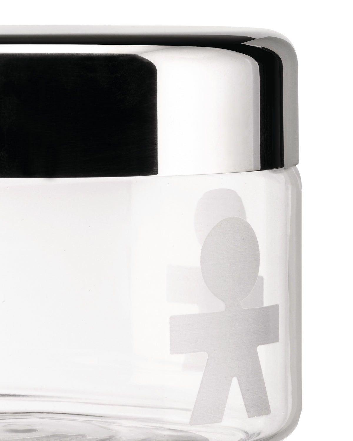 Clear glass storage jar with a chrome lid by Alessi, featuring a frosted boy figure pattern in a close-up side view.