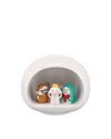 White ceramic stylized nativity scene by Alessi with three colorful, smiling figures inside an oval display.