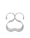 Silver polished metal wine bottle holder by Alessi, featuring an abstract, wavy, multi-layered design.