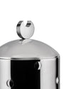 Silver jar by Alessi with a crescent moon lid handle and moon-shaped side cutouts, cropped.