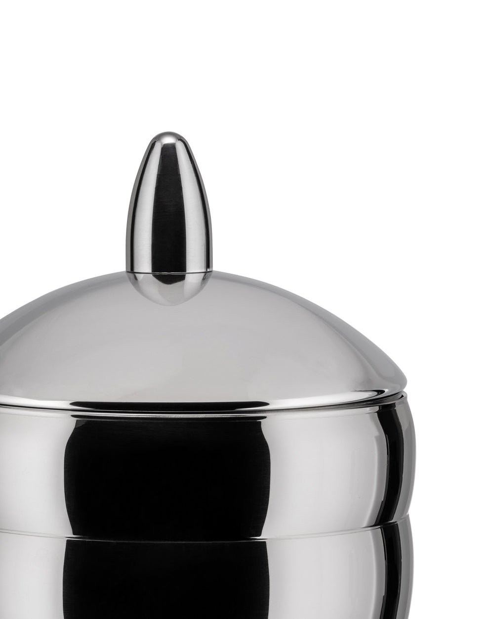 Shiny metal jar by Alessi with a domed lid and pointed finial, cropped close-up.