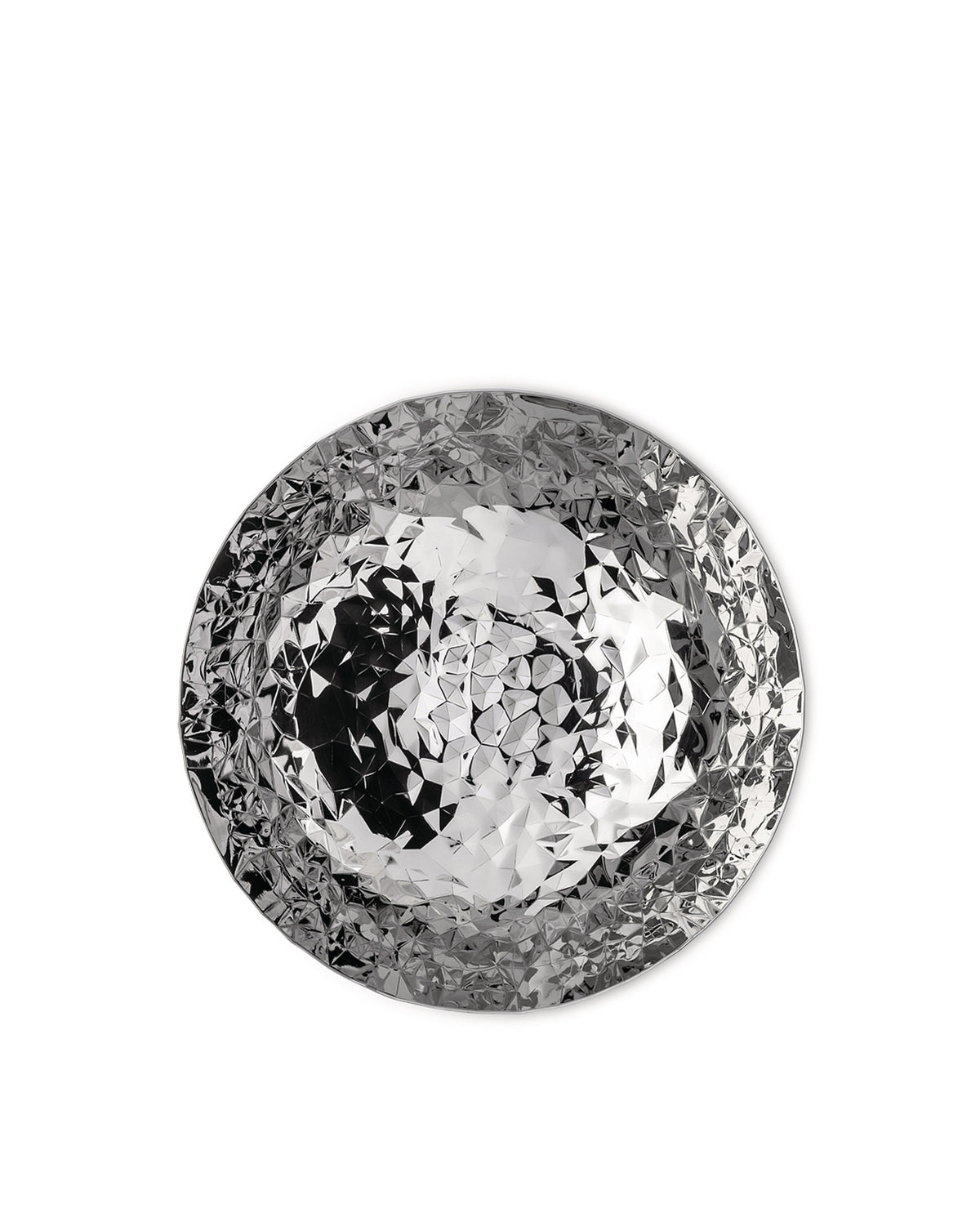 Round silver platter by Alessi with a faceted geometric surface.