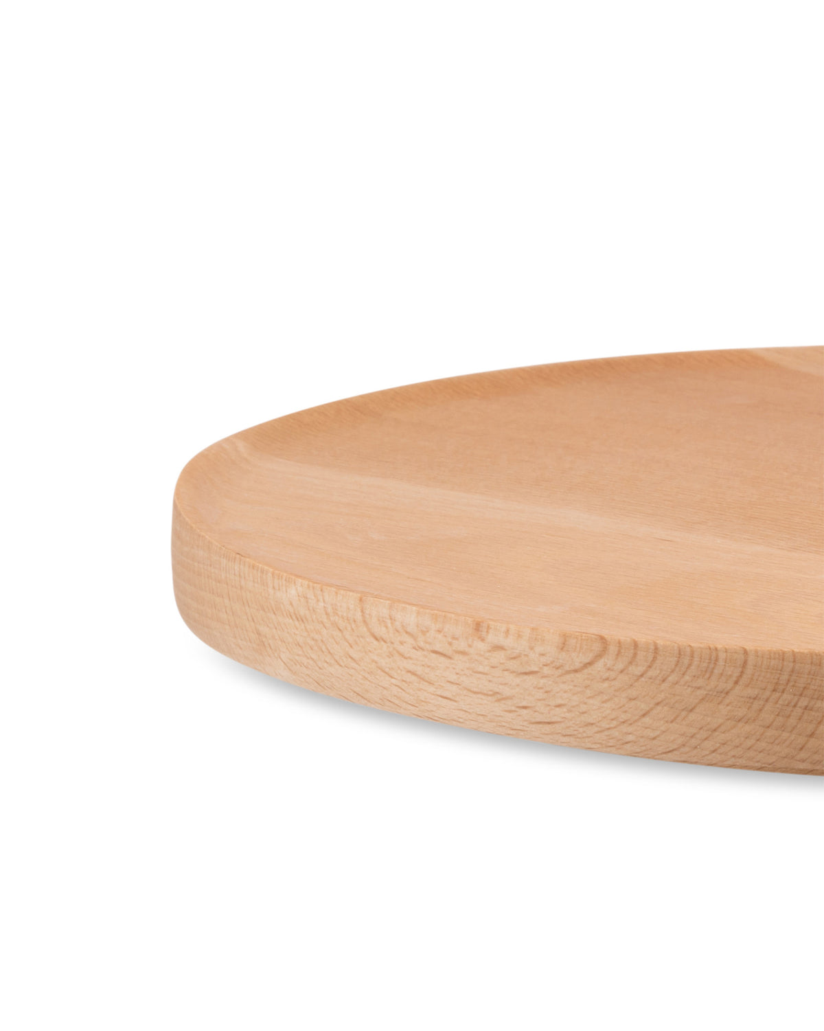 Natural wood serving board by Alessi, with a smooth surface and rounded edge, cropped view.