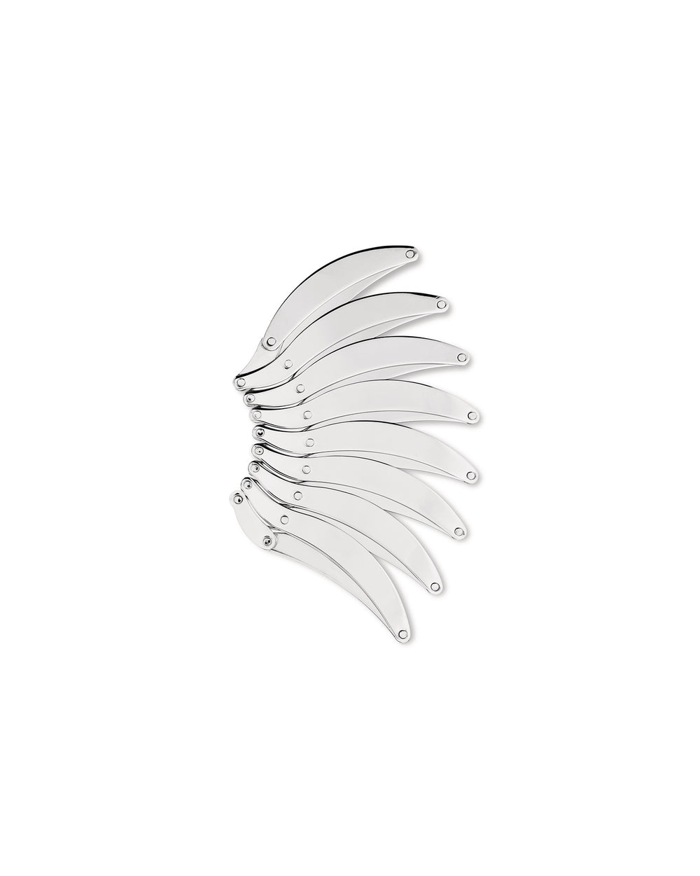 Silver metal trivet by Alessi, featuring multiple interlocking curved segments.