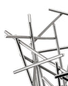 Silver metal fruit bowl by Alessi, featuring an abstract design of intersecting polished rods, close-up view.