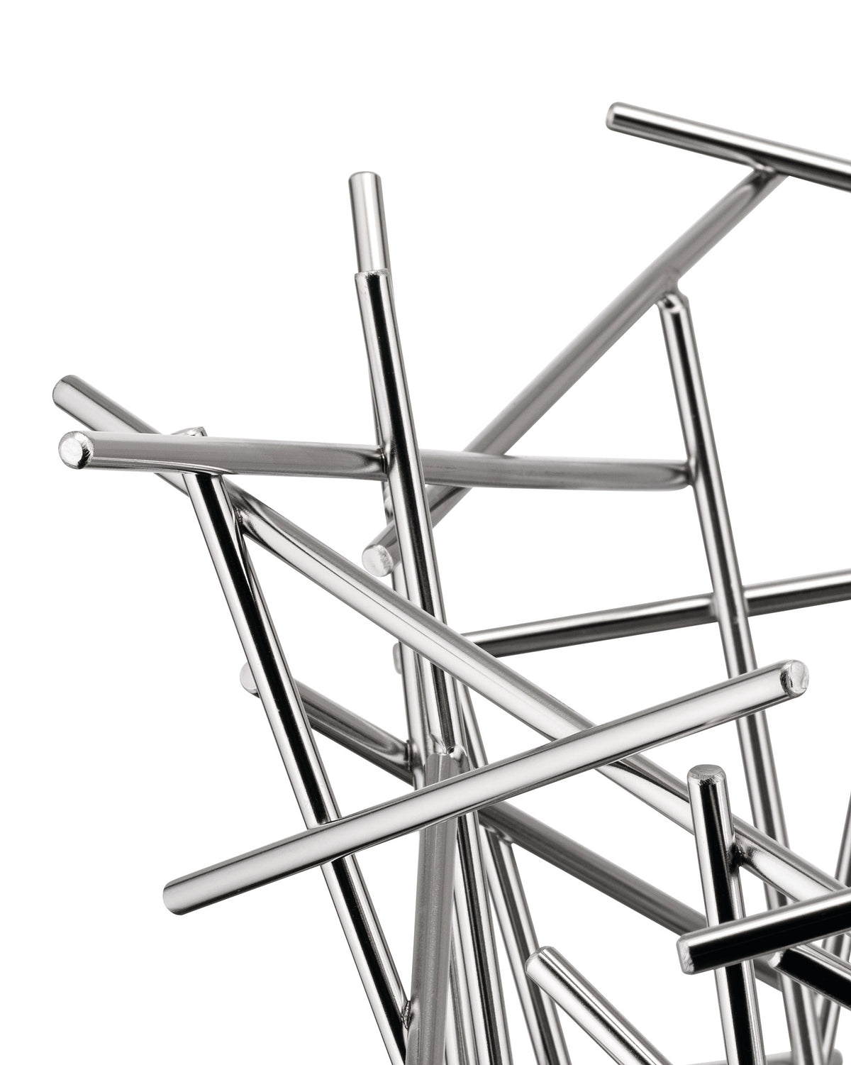 Silver metal fruit bowl by Alessi, featuring an abstract design of intersecting polished rods, close-up view.