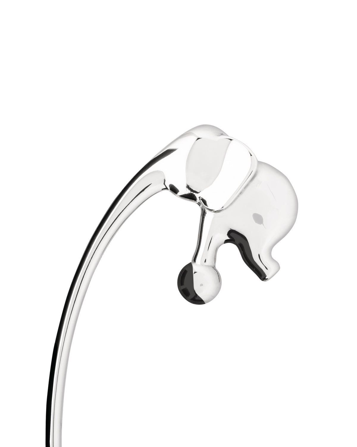 Chrome elephant-shaped object by Alessi on a curved stand, with reflective surfaces and a visible black accent.