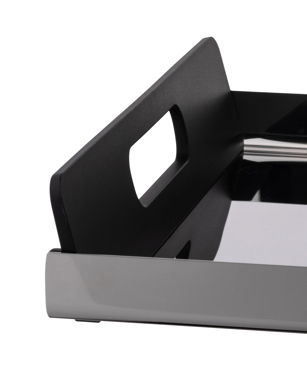 Black and metallic grey serving tray by Alessi with integrated handles and a reflective surface, close-up side view.