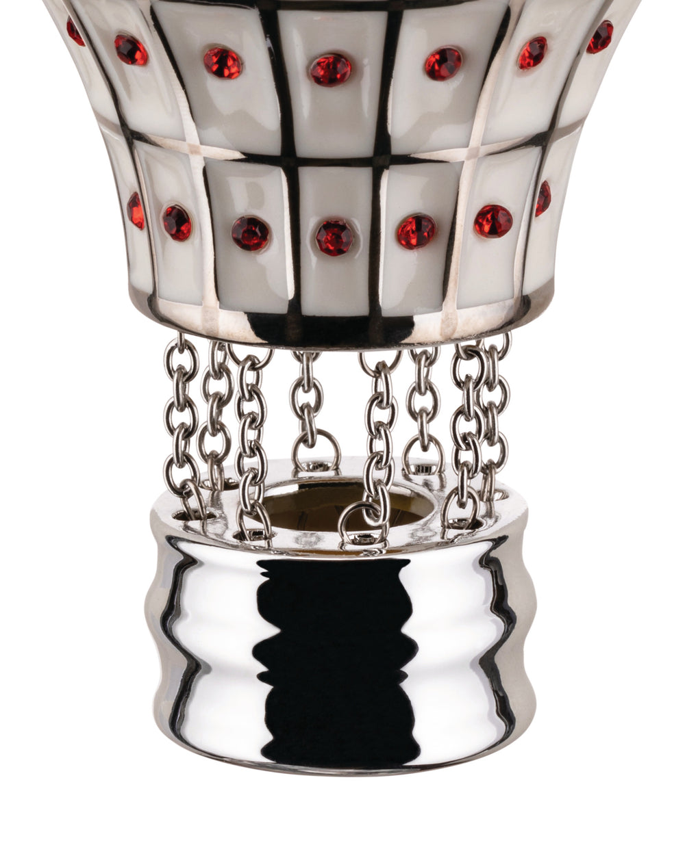 White and silver decorative hot air balloon by Alessi, with red jewels, black grid, and silver chains to a wavy base.