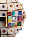 White and gold Engagement Ball by Alessi, richly adorned with colorful faceted gems and a prominent multi-colored square motif.