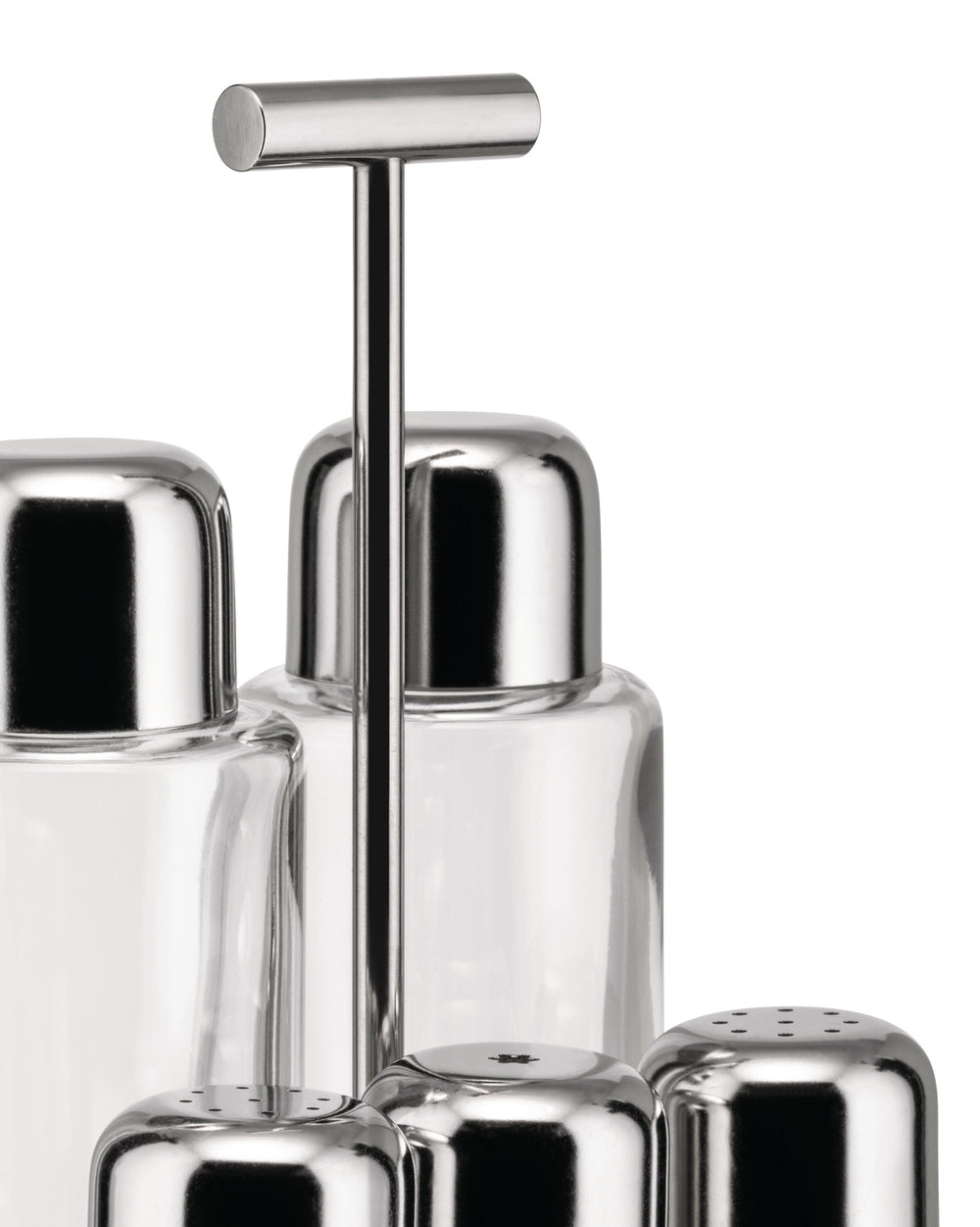 Stainless steel and glass oil cruet set by Alessi, featuring sleek caps and perforated shakers on a stand.