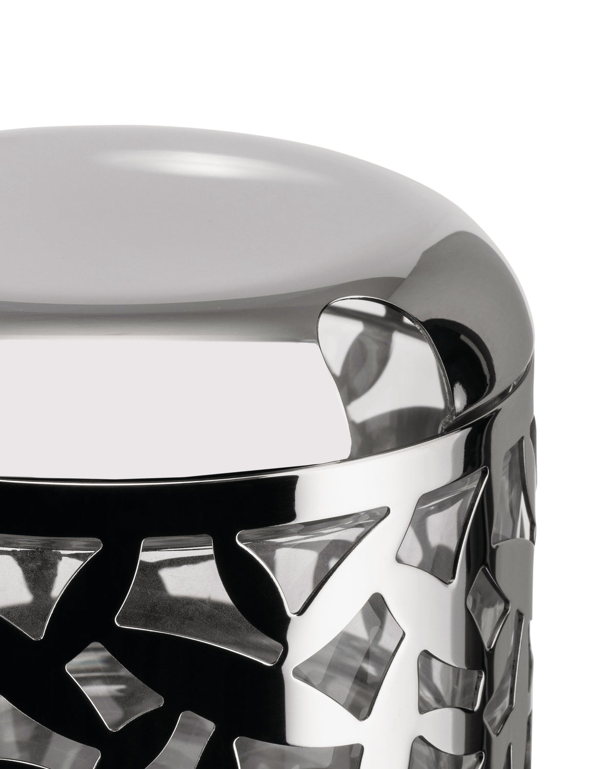 Polished silver metal cheese cellar by Alessi, featuring a geometric cut-out pattern on the side in a close-up.