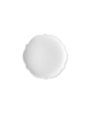 White scalloped-edge plate by Alessi, plain and circular, viewed from above.