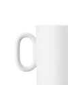 White ceramic mug by Alessi, featuring a smooth, rounded handle in a cropped side view.