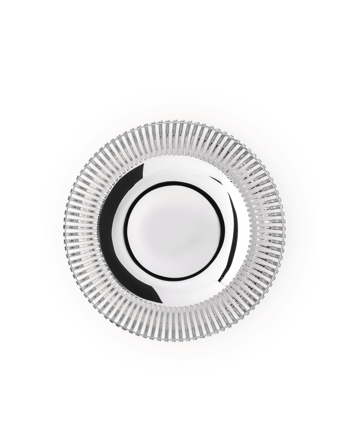 Round silver charger plate by Alessi with a reflective center and a ridged, vertically grooved rim.