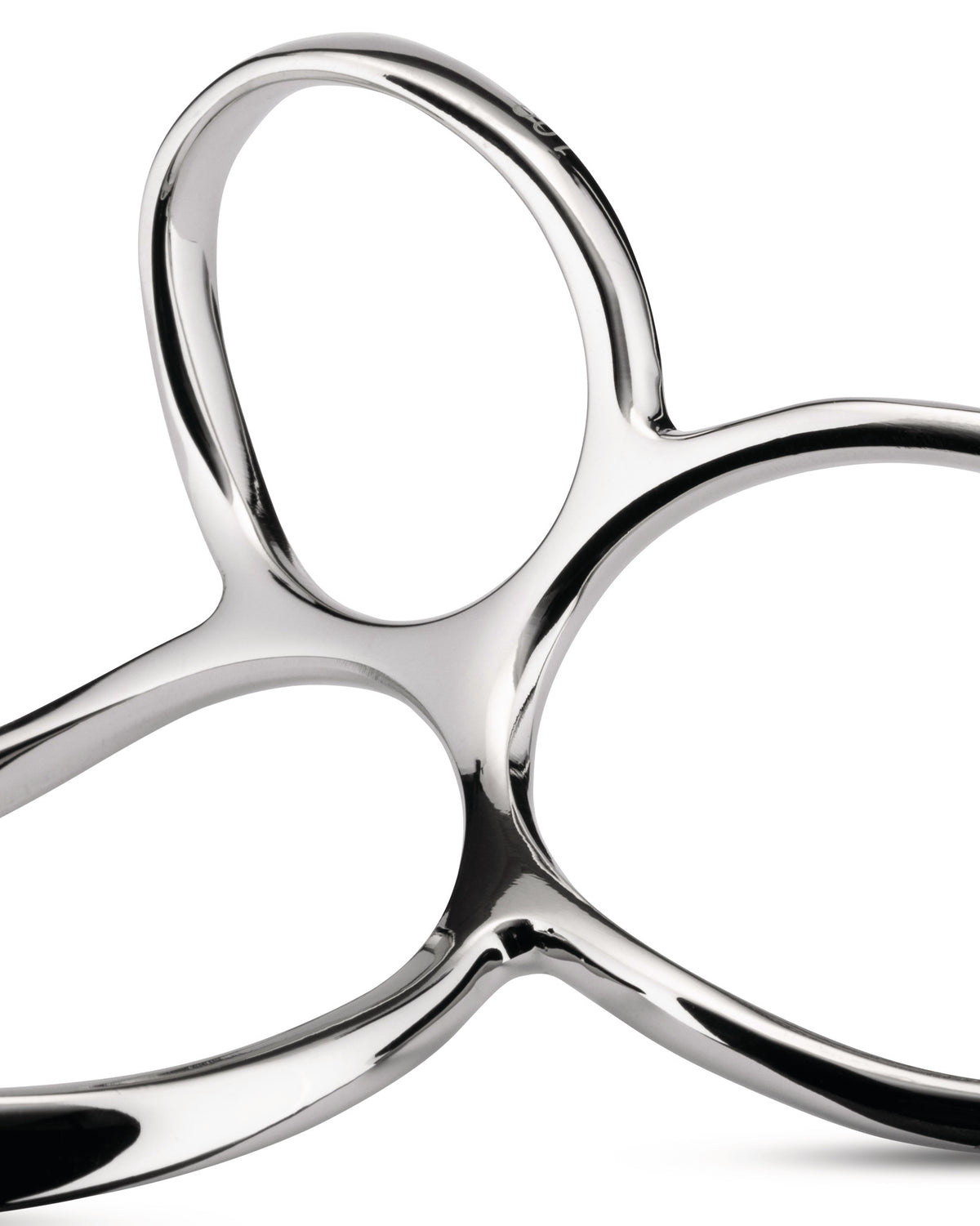 Polished silver metal serving tongs by Alessi with an abstract, fluid, and reflective design.