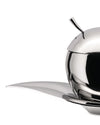 Polished stainless steel oil cruet by Alessi, sphere-shaped with a curved spout, on a leaf-shaped tray, cropped side view.