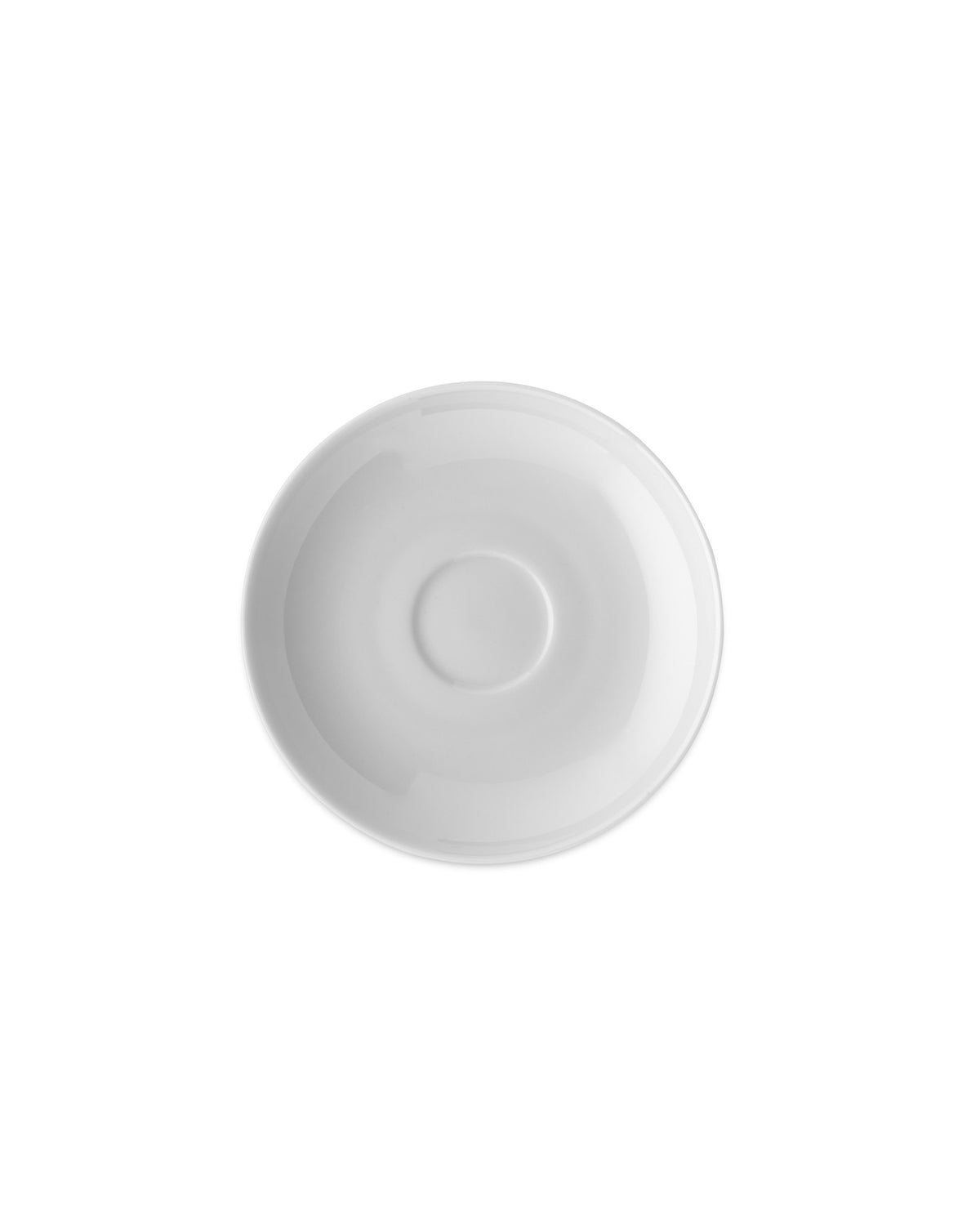 White porcelain saucer by Alessi, seen from above with a smooth finish and a central cup well.