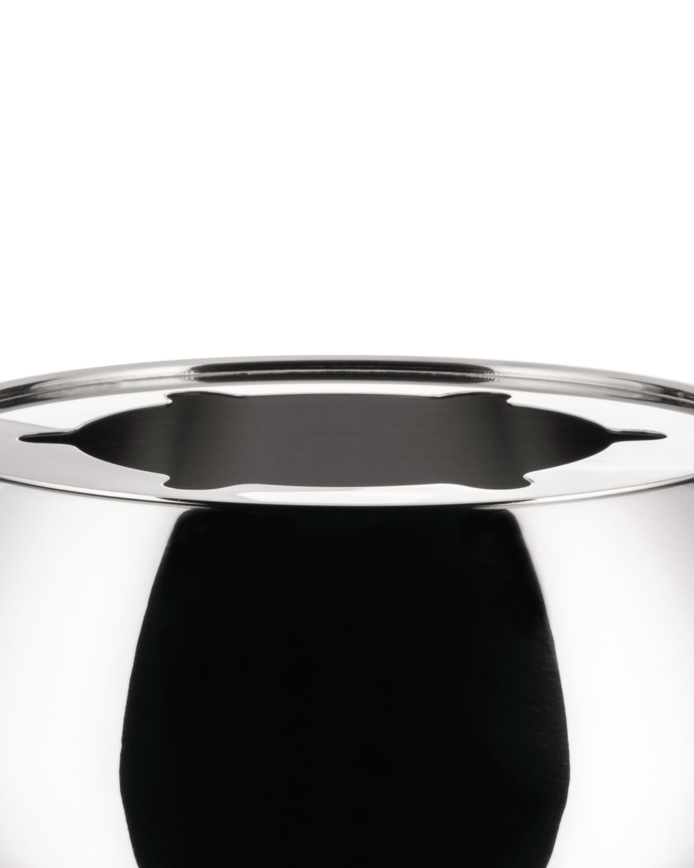 Highly reflective silver-tone stainless steel pot by Alessi with a decorative cutout rim.