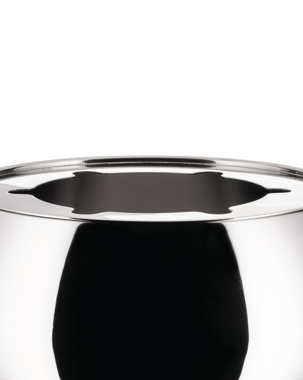 Highly reflective silver-tone stainless steel pot by Alessi with a decorative cutout rim.