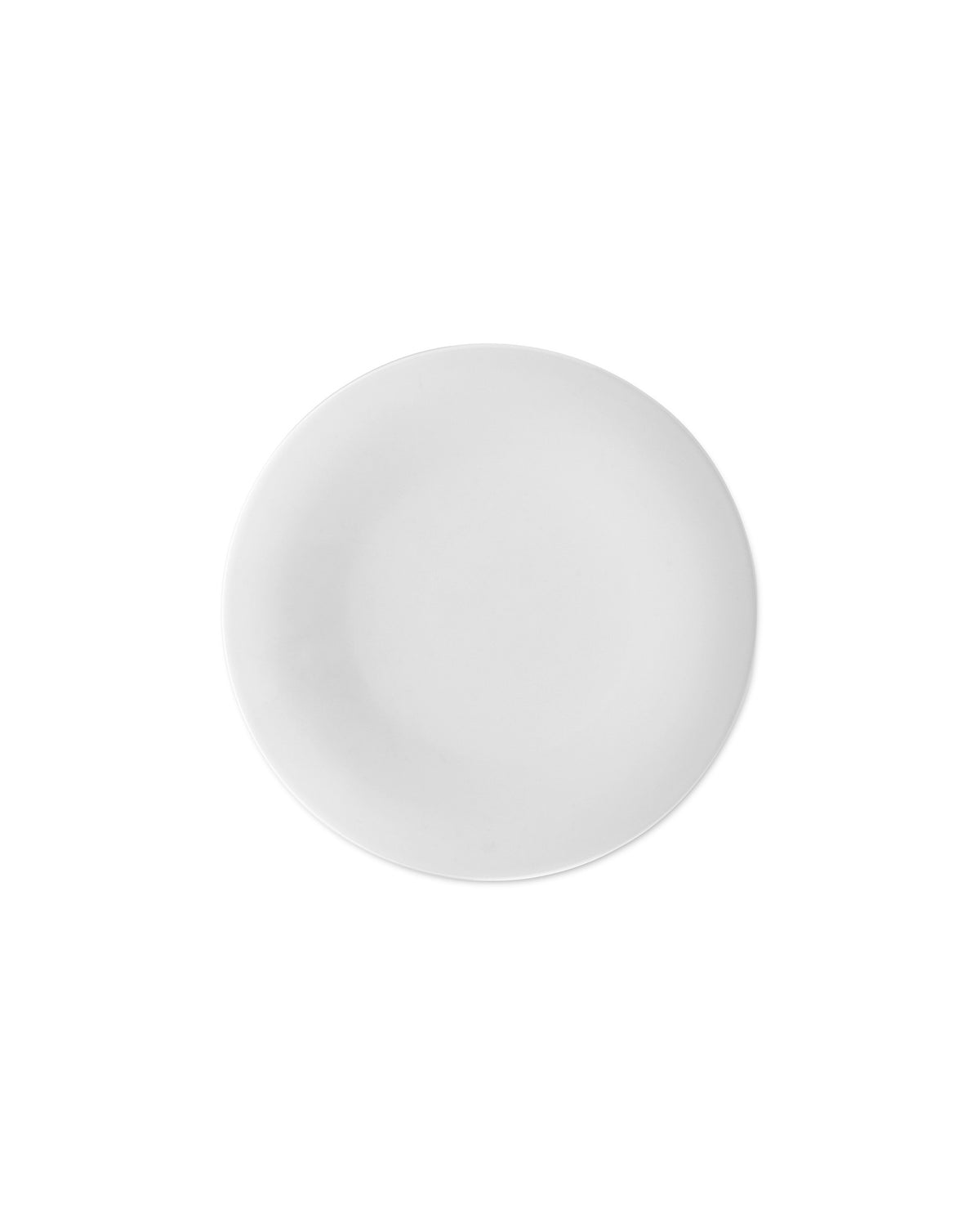 White round plate by Alessi, minimalist design with a matte finish from a top-down view.