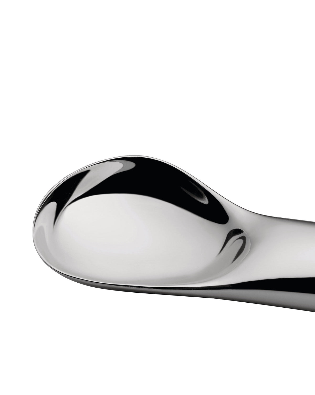 Silver serving spoon by Alessi with a highly polished, reflective, and sleek curved design, shown in a close-up.