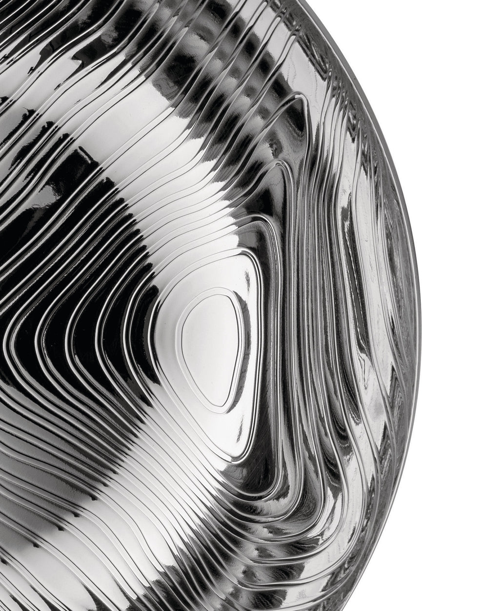 Silver metallic veneer by Alessi, showcasing an undulating, glossy surface.