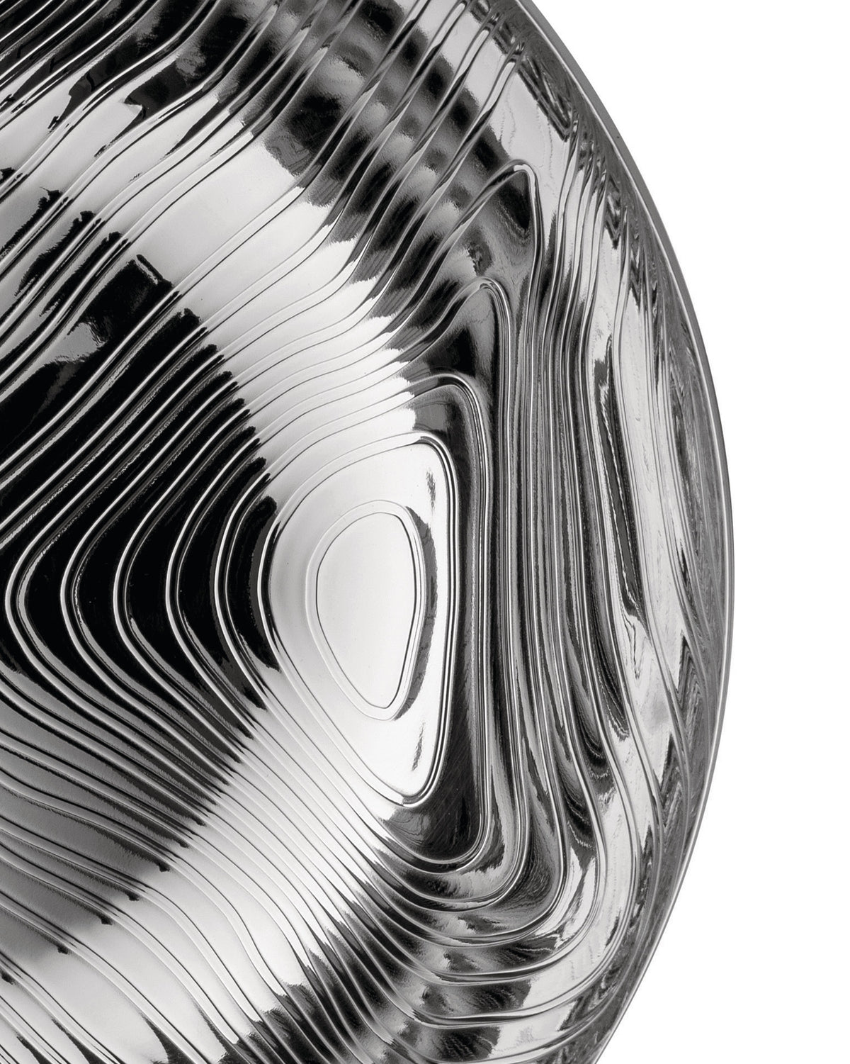 Silver metallic veneer by Alessi, showcasing an undulating, glossy surface.