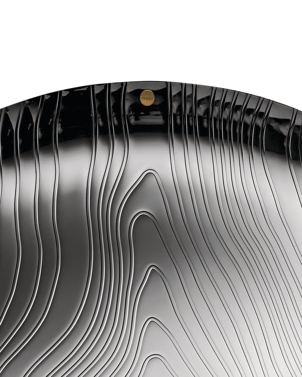 Dark metallic veneer by Alessi with wavy, ridged contours and a glossy finish.