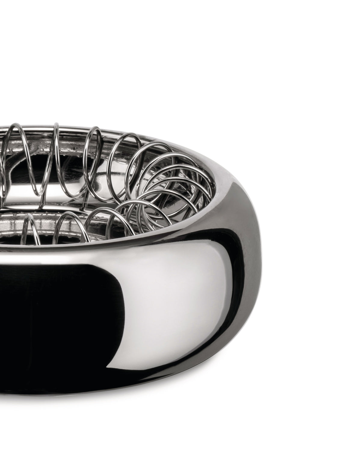 Silver metal Spirale bowl by Alessi with a polished exterior and intricate coiled wire interior, close up.