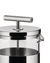 Polished stainless steel and glass French press by Alessi with a T-bar handle and transparent cylindrical carafe.