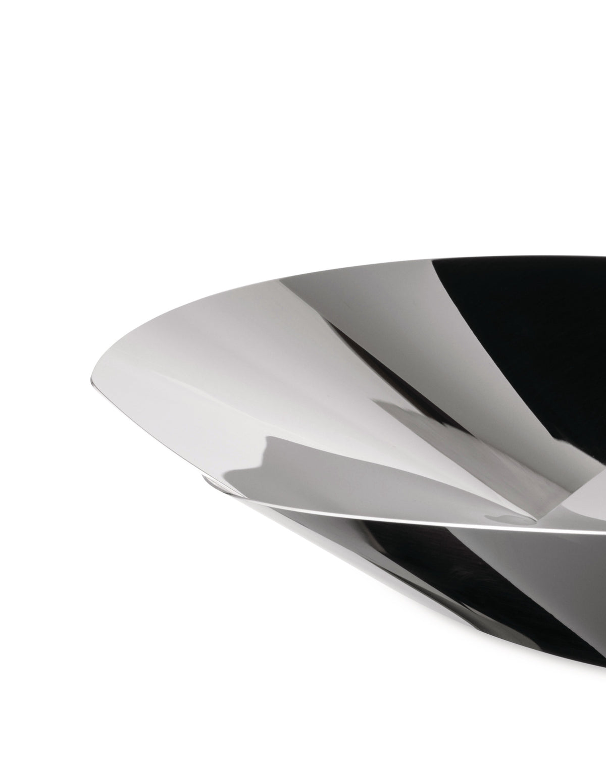 Silver-toned sculptural bowl by Alessi with a highly reflective surface, featuring dynamic, angular folds creating sharp contrasts of light and shadow.