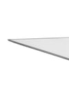 Silver serving cutlery by Alessi with a polished, angled metallic edge in a close-up.