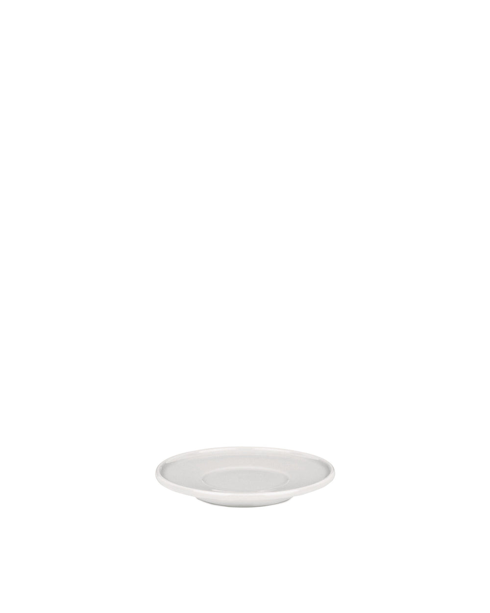 White ceramic round plate by Alessi with a raised rim and subtle central depression, low angle.
