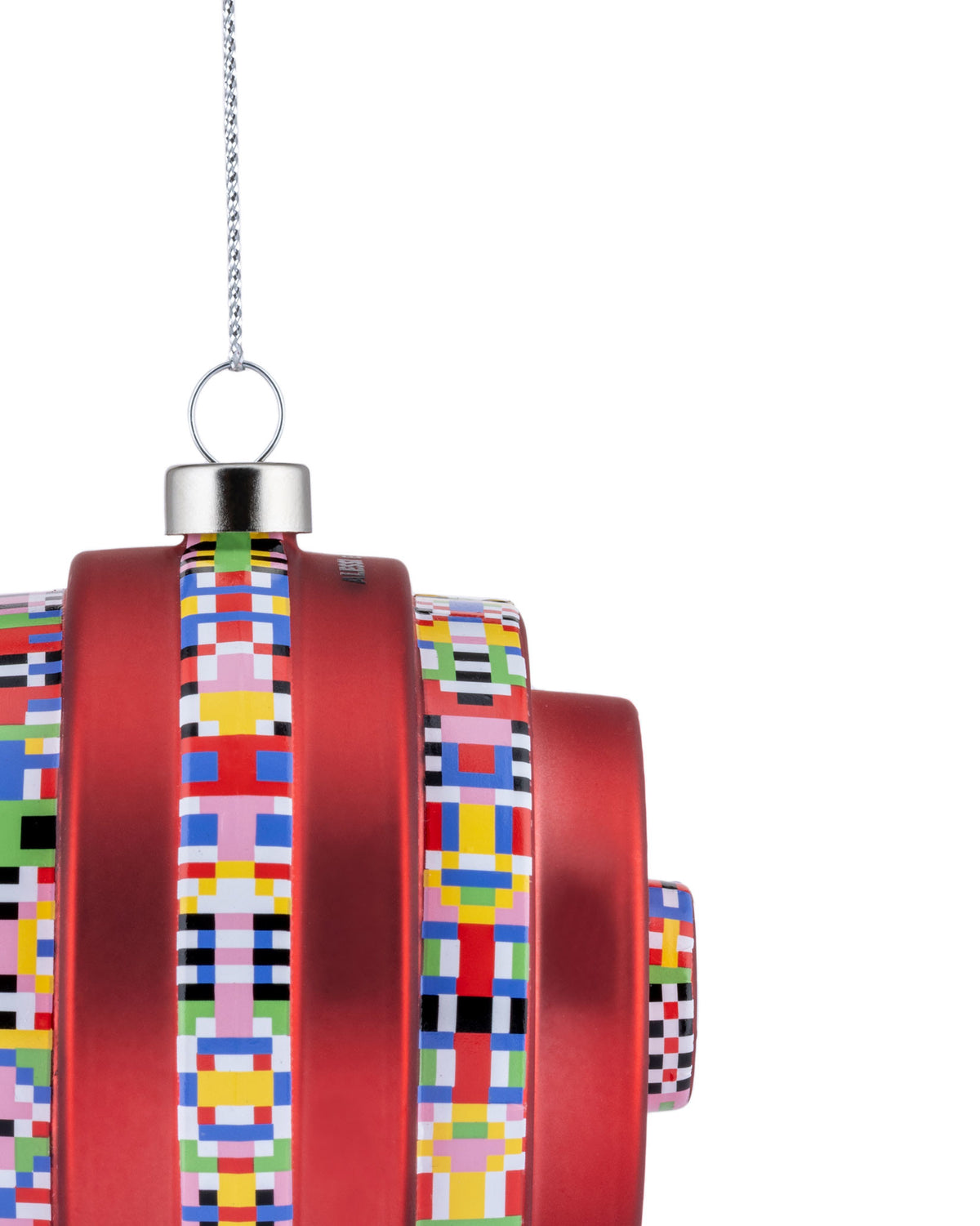 Red tiered Christmas ornament by Alessi, hanging and adorned with colorful pixelated geometric bands.