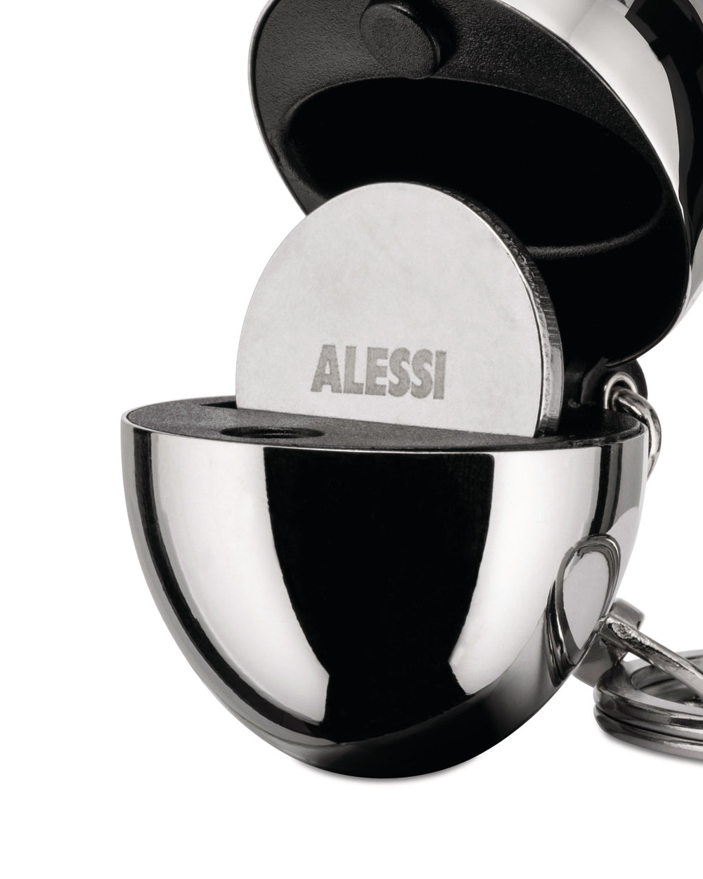 A polished chrome spherical keychain by Alessi, open to reveal a black textured interior holding a silver disk with 'ALESSI' engraved.