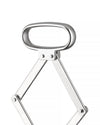 Polished silver metal corkscrew by Alessi with an oval handle and articulating arms, cropped on white.