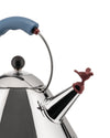 Polished stainless steel kettle with a blue handle by Alessi, featuring a red bird whistle and a black abstract drawing.