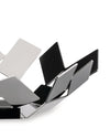 Polished metal decorative bowl by Alessi, featuring a sculptural geometric folded design with reflective surfaces.
