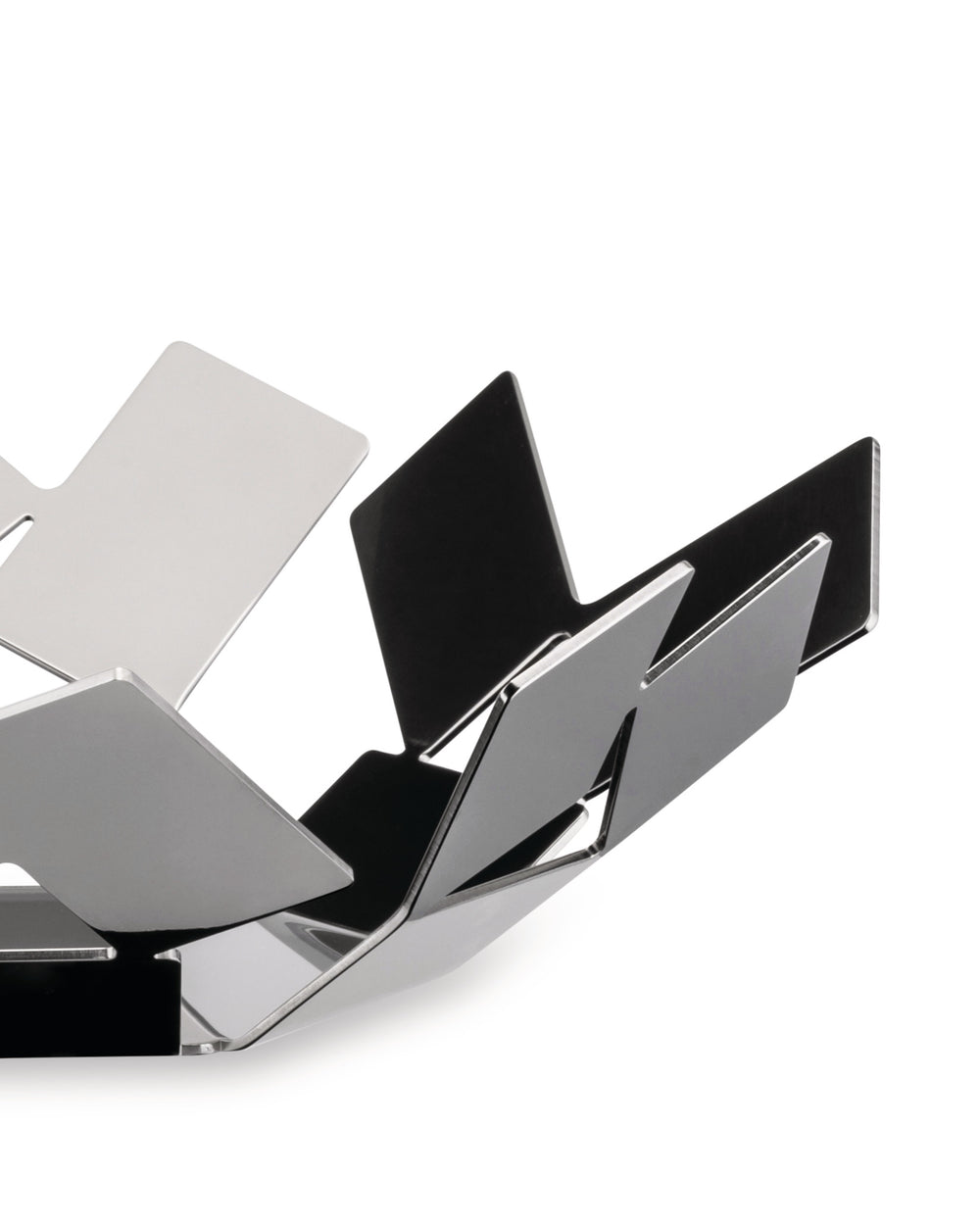 Polished metal decorative bowl by Alessi, featuring a sculptural geometric folded design with reflective surfaces.