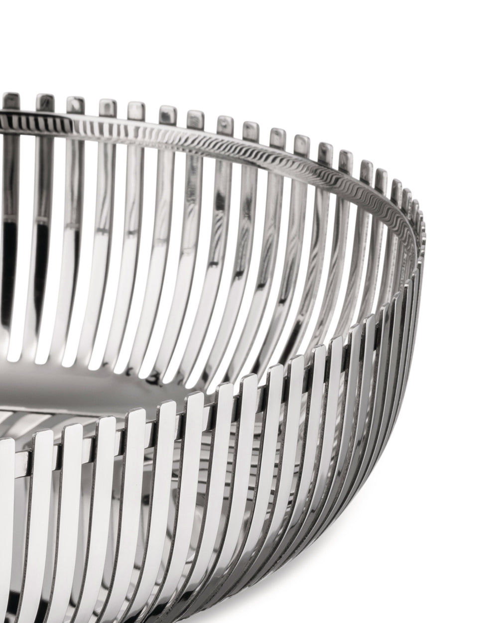 Silver metal basket by Alessi with vertical slats and a textured top rim, shown cropped.