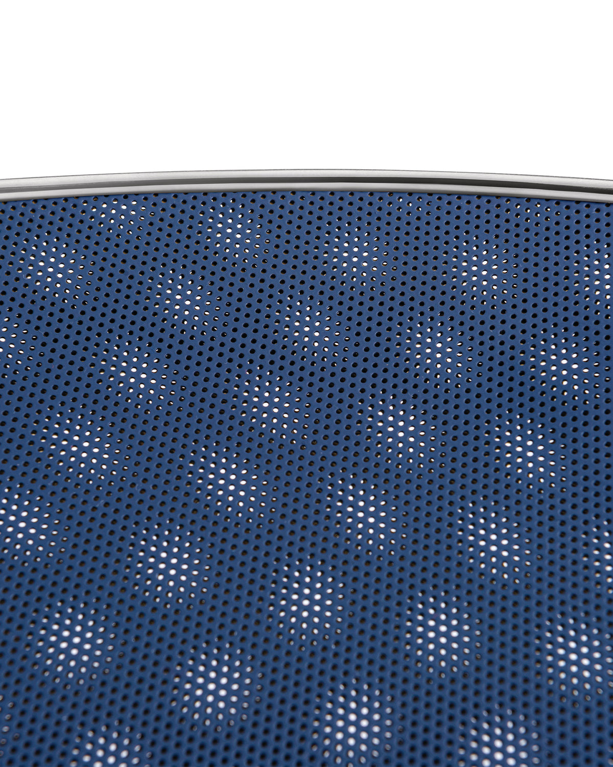 Blue Cohncave by Alessi, a perforated bowl with a silver metallic rim, revealing a white background through its small holes.
