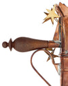 Copper coffee maker with a wooden handle by Alessi, featuring star and heart-shaped decorative elements.