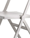 A white folding chair by Alessi, a cropped close-up showing the minimalist seat and hinge mechanism.