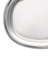 Silver oval serving tray by Alessi, a close-up showing its highly reflective surface and raised edge.