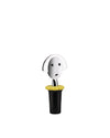 A chrome and black bottle stopper with a yellow collar by Alessi, featuring a smiling face design on the head.